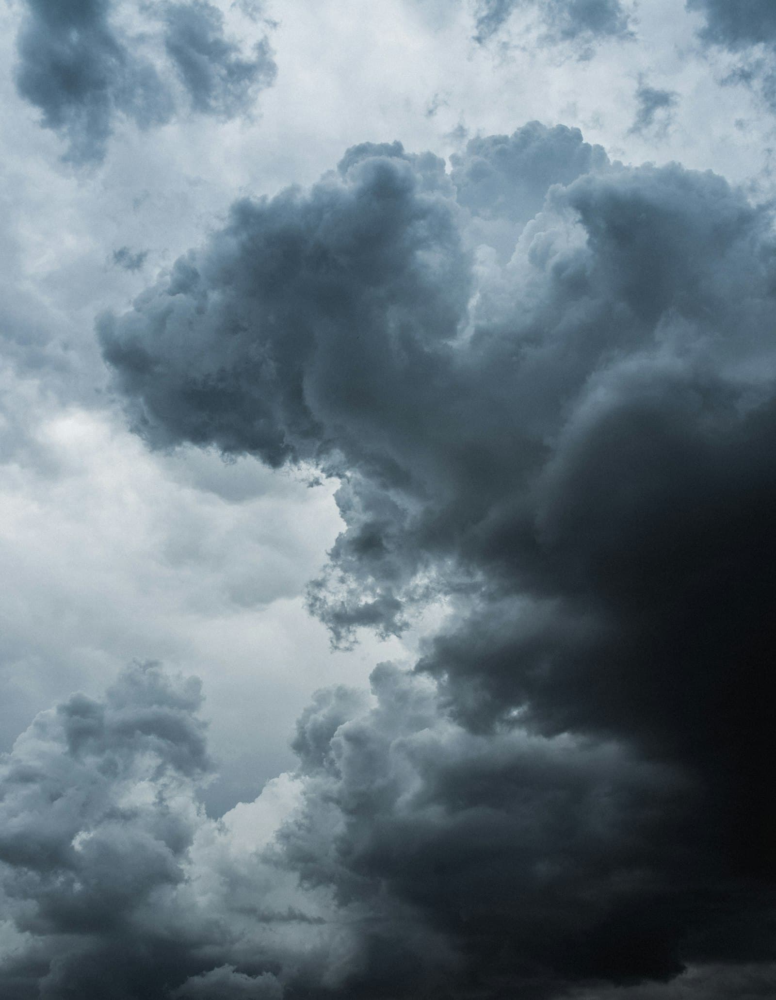 Bright blue sky above soft white clouds