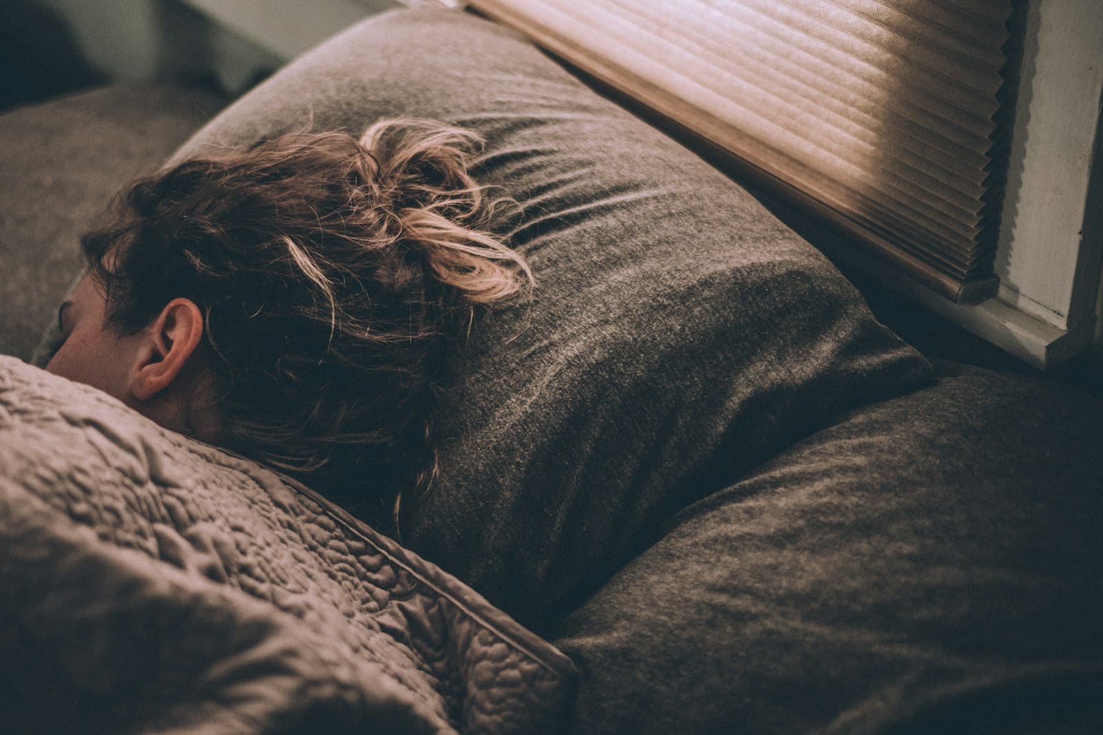 Person resting peacefully in soft morning light